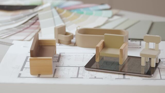 Miniature wooden furniture on architectural blueprint with soft lighting. AI Digital designer assistant for apartment planning.