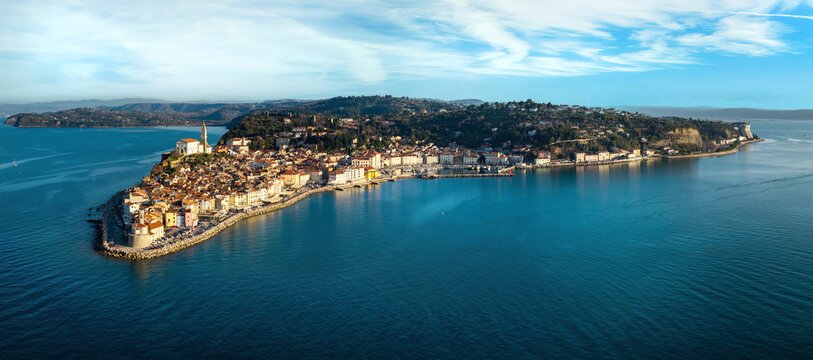 Aerial 12K panorama of Piran old town peninsula and lighthouse cape Adriatic sea Slovenia High Resolution