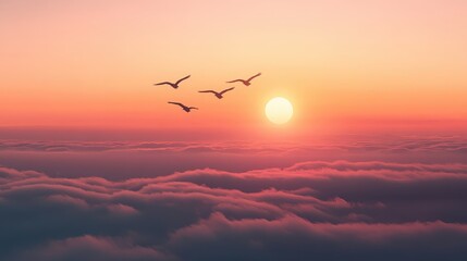 Obraz premium A stunning sunset over the clouds with birds flying gracefully in the warm light of the sun.