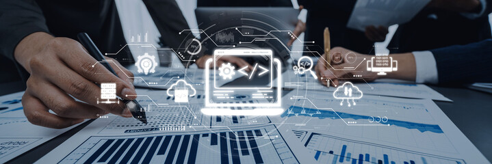 A professional team collaborates to analyze financial data using graphs, charts, and advanced digital technology to enhance innovative strategies in a modern workspace. Trope