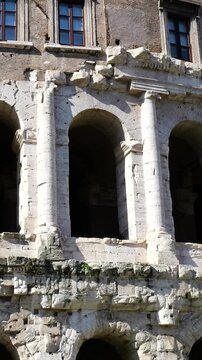 multi arched fa&ccedil;ade ancient theatre marcellus weathered stone columns deep shadowed archways renaissance palace rests atop historic structure rome italy of multi-arched 