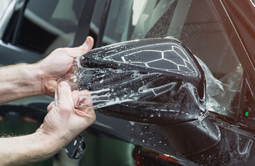 The process of installing PPF on the side mirror. PPF is a protective film for paint that protects...