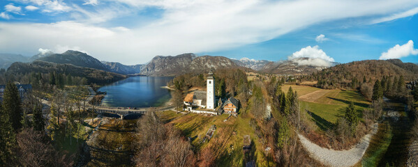 Lake Bohinj Wide Panorama at Golden Hour: Historic Church, bridge and Triglav Mountains, Slovenia Alpine Landscape