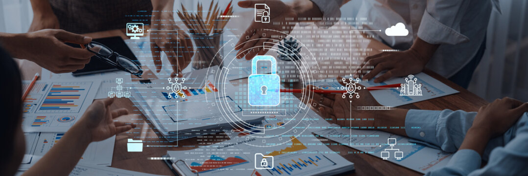 A dynamic business meeting focused on cybersecurity strategy with professionals collaborating around a table, showcasing digital lock graphics and data analysis efforts. Trope