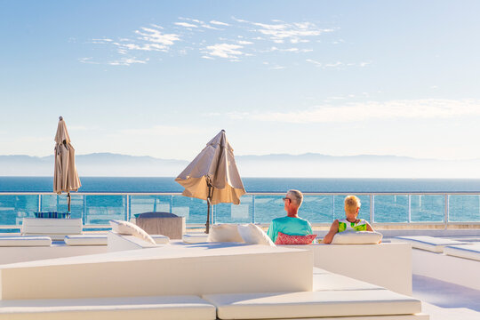 North America, Mexico, Nayarit, Bahia de Banderas, Nuevo Vallarta. Mature couple looking out over ocean. Model Released.