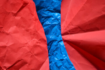 Abstract Background of Vibrant Red and Blue Crumpled Paper Texture