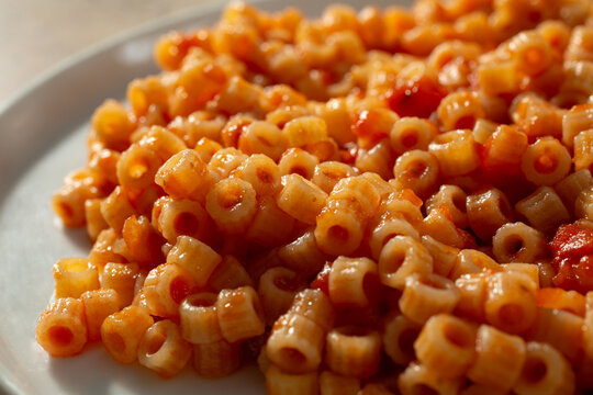A closeup view of a plate of gluten-free ditalini marinara.