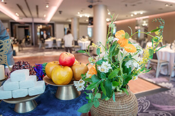 table with flowers and fruits