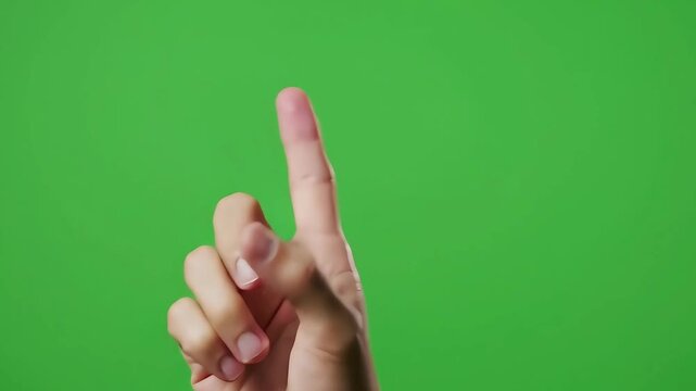 Close-up of a person's index finger pointing upwards against a bright green background, suggesting interaction or selection on a digital interface