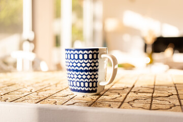 cup of coffee on the table in morning light