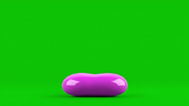 A single shiny purple bean-shaped object resting on a vibrant green background.