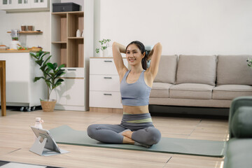 Fototapeta premium Asian healthy woman workout at home, exercise, fit, doing yoga, home fitness concept.