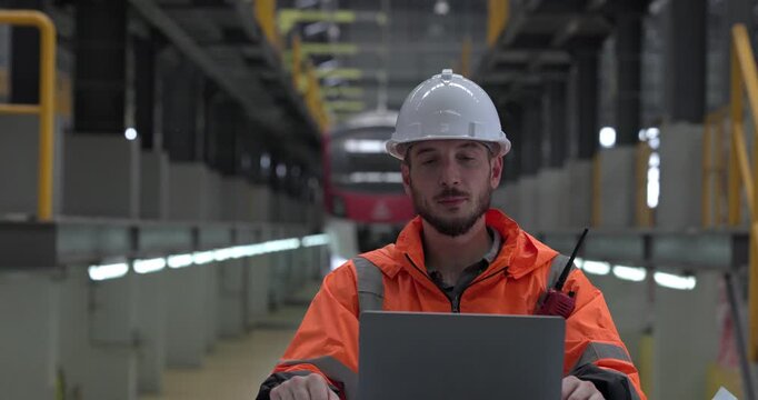 Rail maintenance engineer assessing condition of infrastructure. Planning and executing upgrades to rail system that reduce co2 footprint, enhance energy efficiency, focusing on sustainable practices
