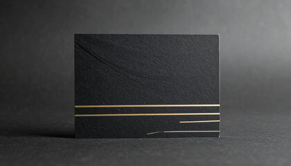 Black card with gold horizontal lines on dark background