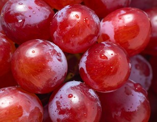 A close-up view of fresh, juicy red grapes with water droplets