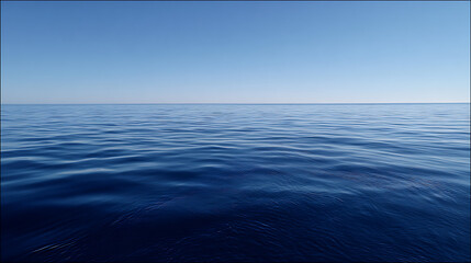 Fototapeta premium Deep Blue Ocean Water Under Clear Blue Sky Horizon