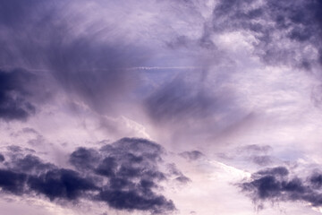 Obraz premium Purple sky with layered clouds and soft light. Abstract natural background.