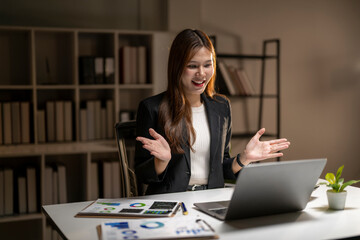 Businesswoman having video call meeting on laptop