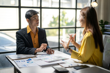 Business people discussing financial data during office meeting