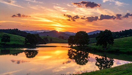 Scenic sunset over a tranquil lake, reflecting warm colors, framed by rolling hills