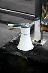 Electronic megaphone on white background. Loud-speaking device