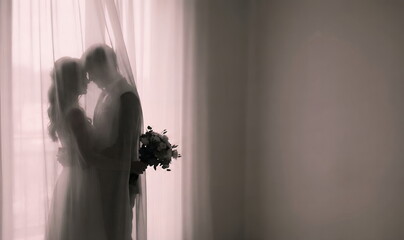 Generated AI - Ethereal Silhouette of a Newlywed Couple Embracing Behind Sheer Curtains, Dreamy Wedding Photography Style with Soft Backlighting and Floral Bouquet.