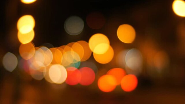 Cityscape at Night with Blurred Lights and Traffic Movement Captured from a Distant Viewpoint in an Urban Environment
