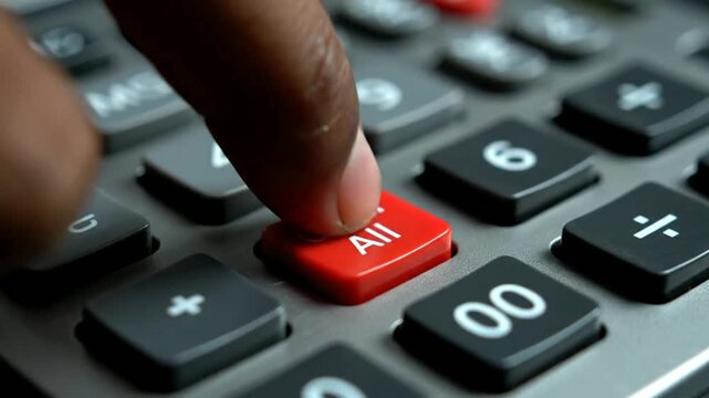 Finger Pressing Calculator Buttons Closeup.