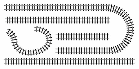 Overhead view of a model railroad track layout with curves and straights