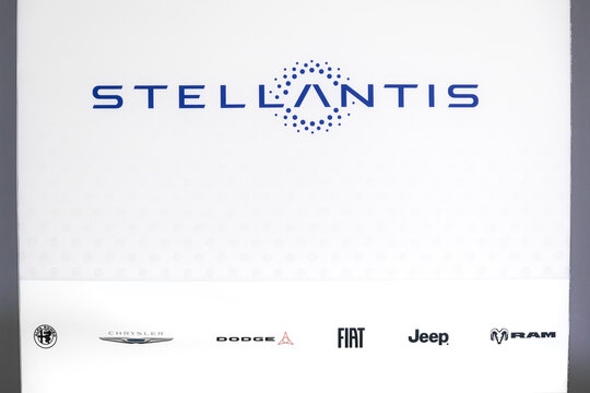 Stellantis corporate brand logo and automotive company brands display at Detroit auto show in Michigan.