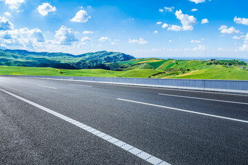 Obraz premium Empty asphalt highway road and green mountain natural landscape in summer
