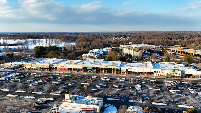 The strip mall of The Shoppes at Brinton Lake after snow in winter in Glen Mills, suburb of Philadelphia, Pennsylvania
