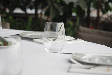 Dinner table set for guests in casual setting