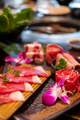 Various type of Japanese style sliced rare beef meat set on the plate, soft focus