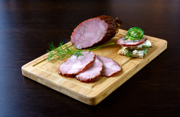 Smoked sausage on wooden board