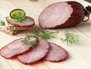 Smoked sausage on wooden board