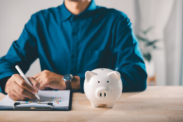 Piggy bank finance money documents save management check document help businessman review budget...