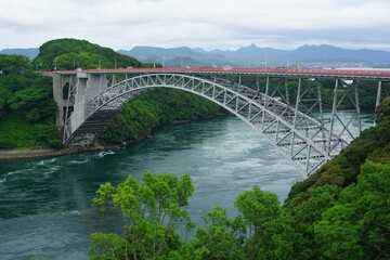 Obraz premium The Saikai Bridge going over the Hario Seto Strait in Sasebo, Japan