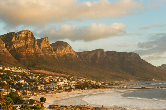 Landscape view of mountains and beach during sunset in coastal town