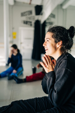 Happy young woman smiling during indoor class