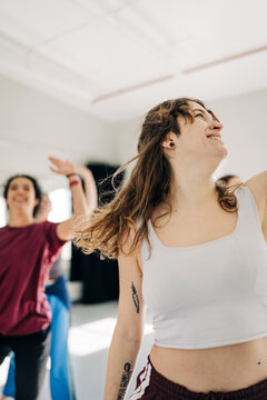 Young woman dancing with joy and freedom