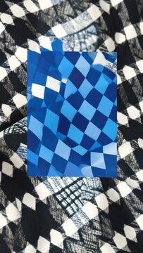 Checkered fabric with a blue, 3D-like checkered inset