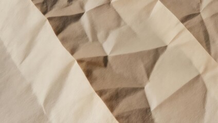 Obraz premium Close-up of folded fabric with diamond pattern in beige and brown tones, soft texture