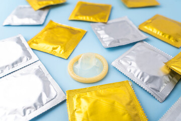 Isolated Condom photo in blue background.