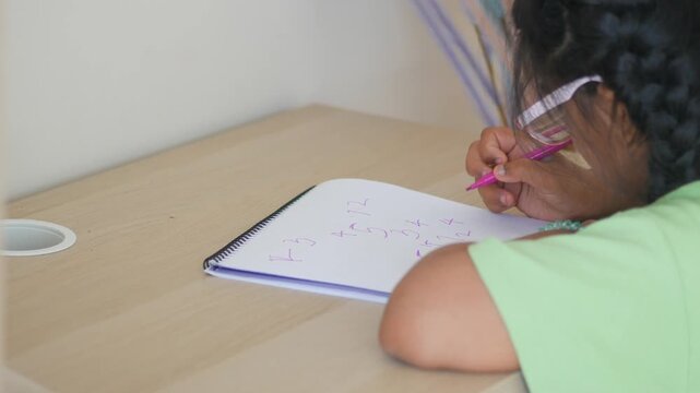 Children learn math at a study table in the afternoon