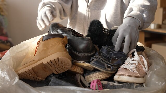 Volunteers sorting donated footwear for community aid