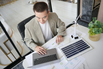 Solar panels green energy Business man working  green eco friendly office business creative idea Planing Bio economy for business eco friendly professional Engineer sustainable electricity