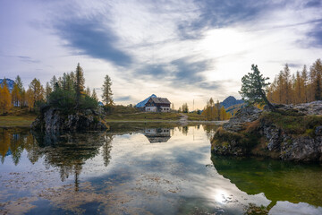 The photo specular landscape of lake Dedera at dolomite in Italy