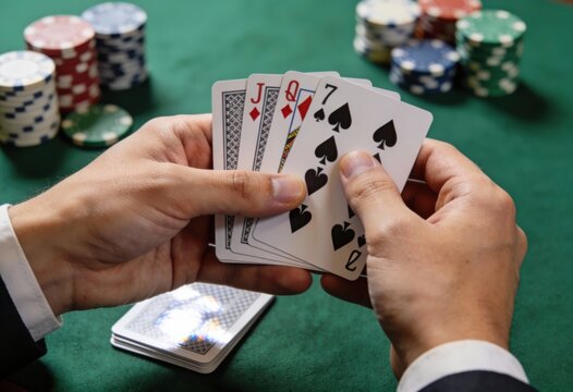 Expert poker player holding a royal flush in a high stakes game surrounded by vibrant poker chips showcasing strategy and excitement in the competitive gambling arena