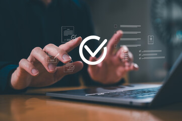 Businessman use computer laptop review electronic files, utilizing intelligent management system to...